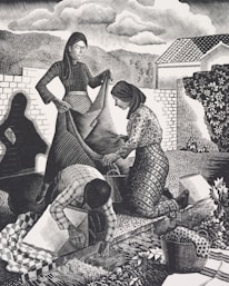 Three figures engaged in communal work outdoors. A woman in a long dress holds a large piece of fabric while another woman kneels, assisting with the fabric. A third person, bending over, works on the ground, surrounded by a basket and patterned textiles. The background shows trees, hills, a house, and a cloudy sky, creating a rural and serene setting.
