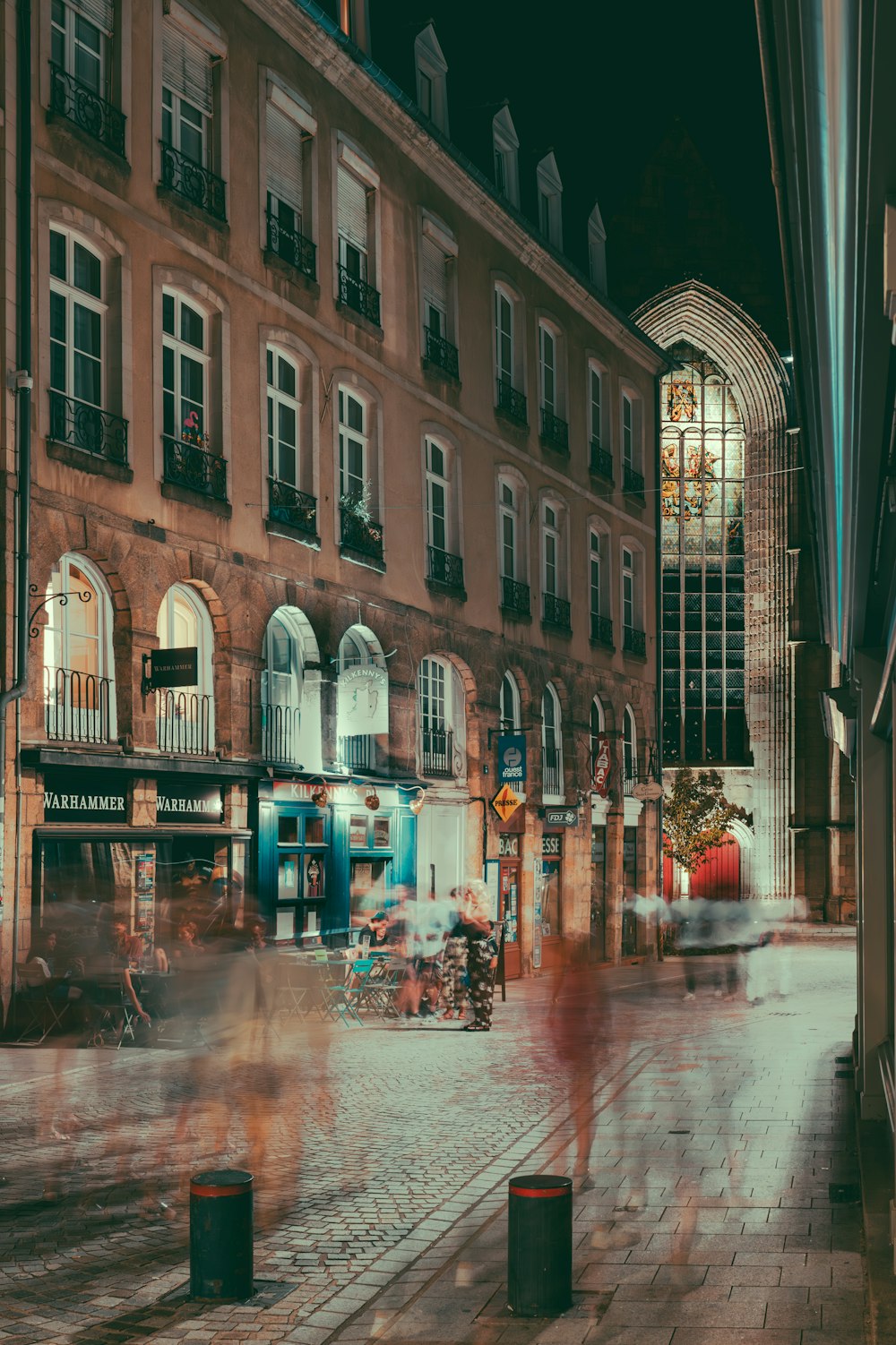 a blurry photo of a city street at night