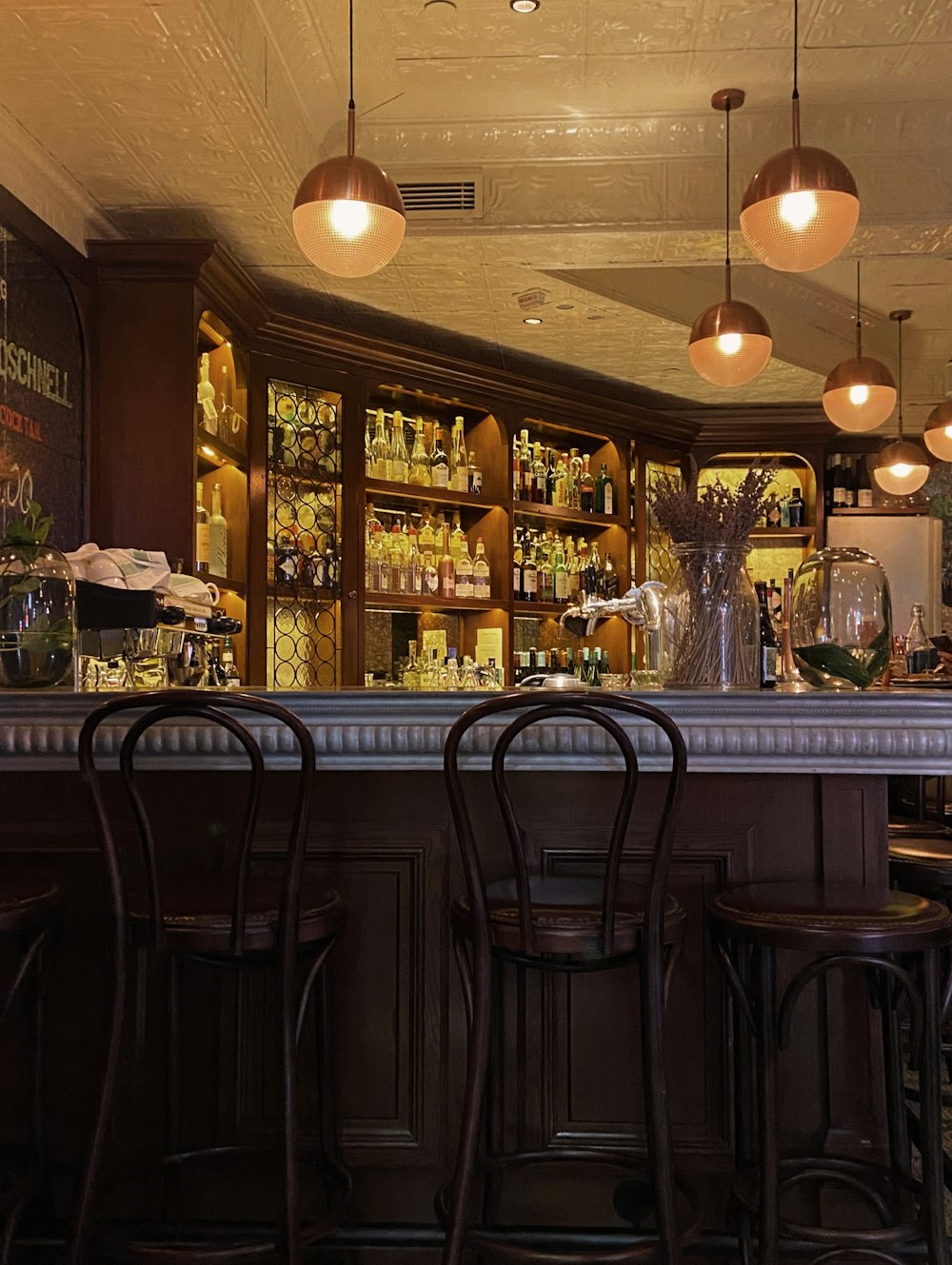 a bar with a bunch of stools in front of it