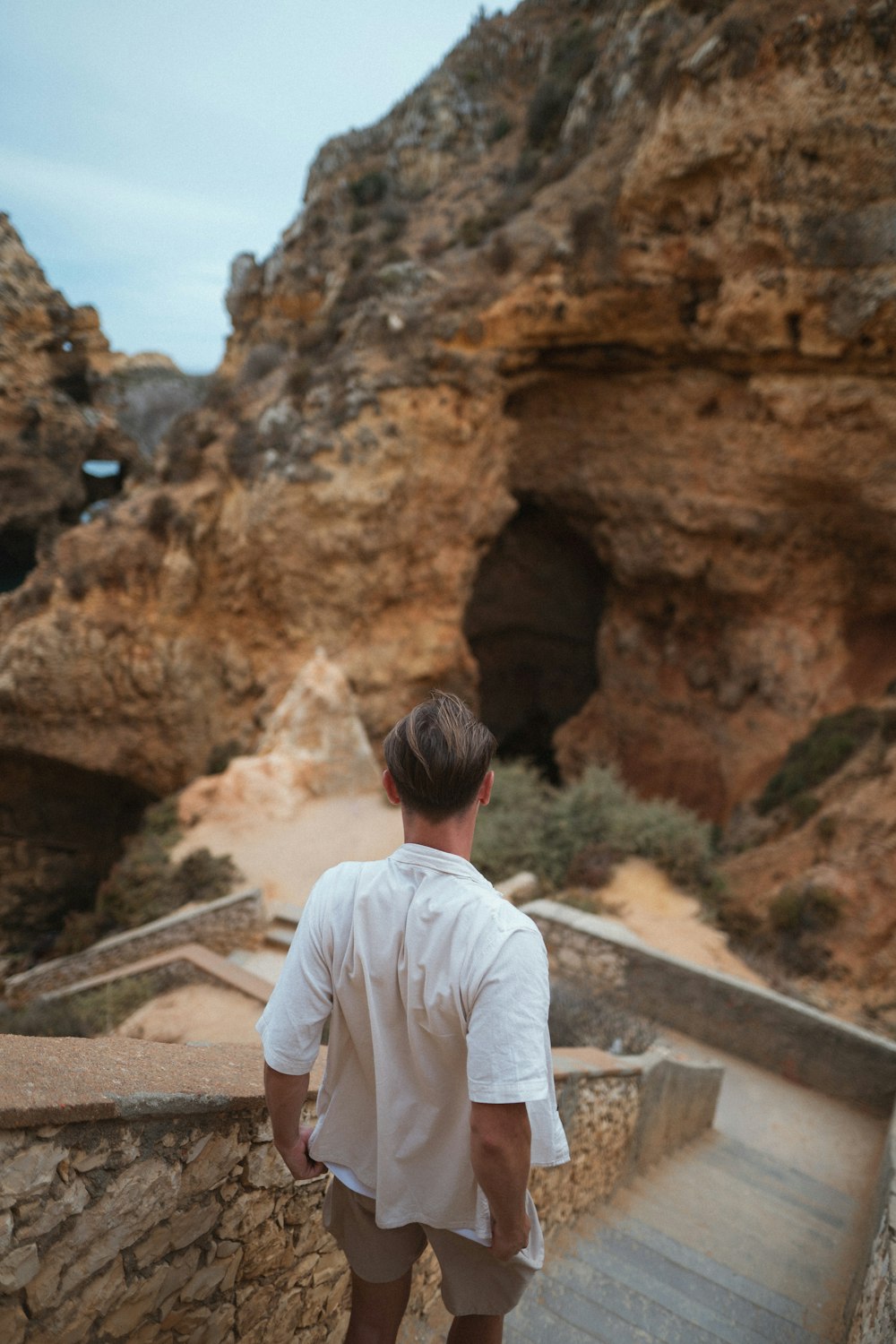 a man is walking up a set of stairs