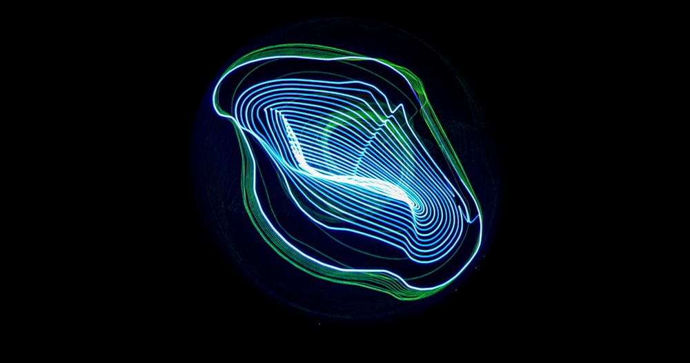 a blue and green swirl on a black background