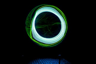 A sleek neon-lit contact form interface glowing against a dark futuristic dashboard background.