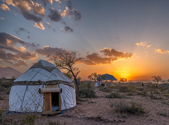 a yurt sitting in the middle of a desert
