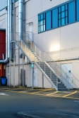 Steel staircase leading to a commercial building.