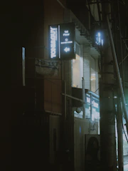 Close-up of a stylish beauty salon illuminated by warm lights against the night.
