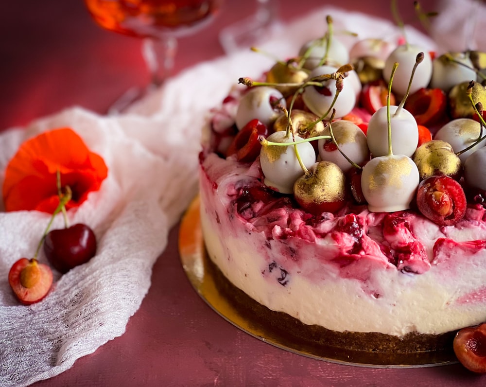 a cake with cherries on top of it