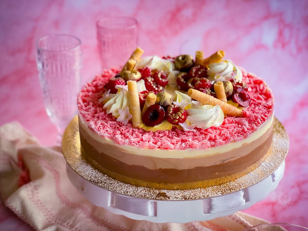 a cake on a table with a glass of water