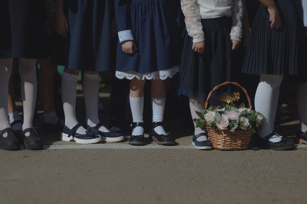 a group of young girls standing next to each other