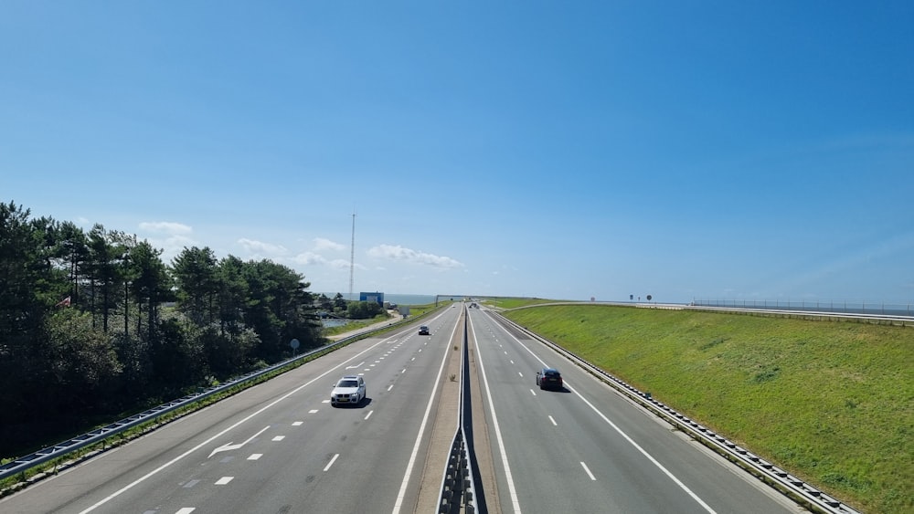 a highway with two lanes of traffic on it