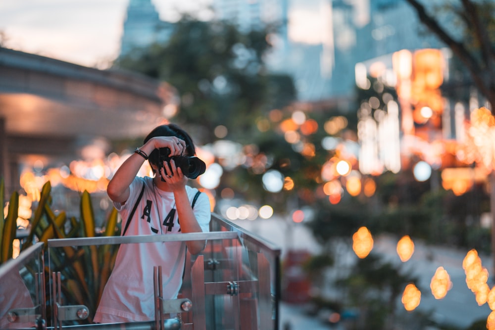 a person taking a picture with a camera