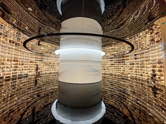 A futuristic library filled with digital screens and books.