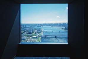 Large windows offering a city view from the suite.