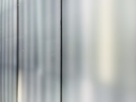 A detailed view of a glass partition in an office space.