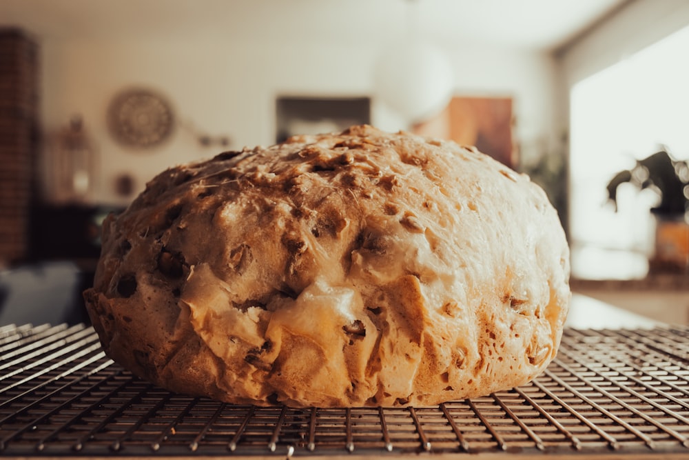 a loaf of bread sitting on top of a cooling rack