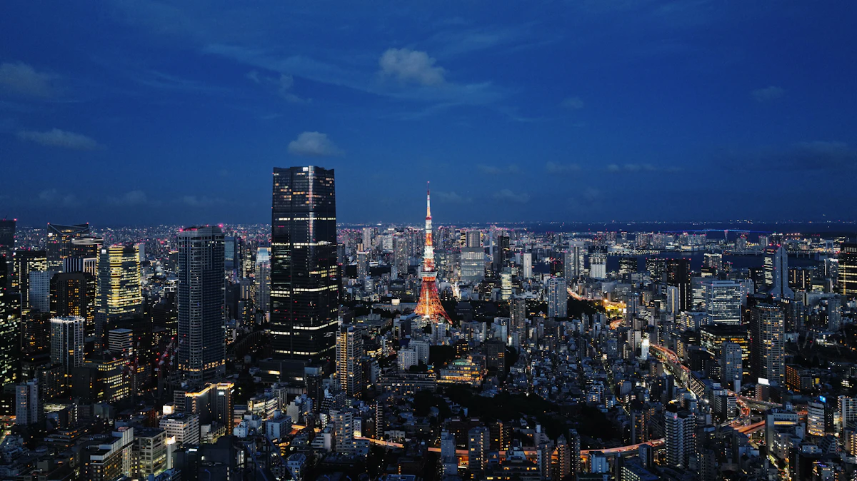 Tokyo cityscape at night with illuminated buildings and streets