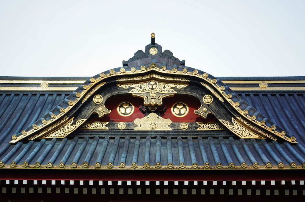 a close up of a roof with a clock on it