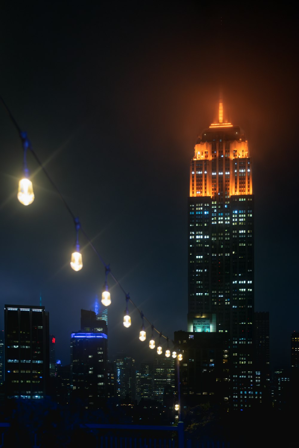 a very tall building lit up at night