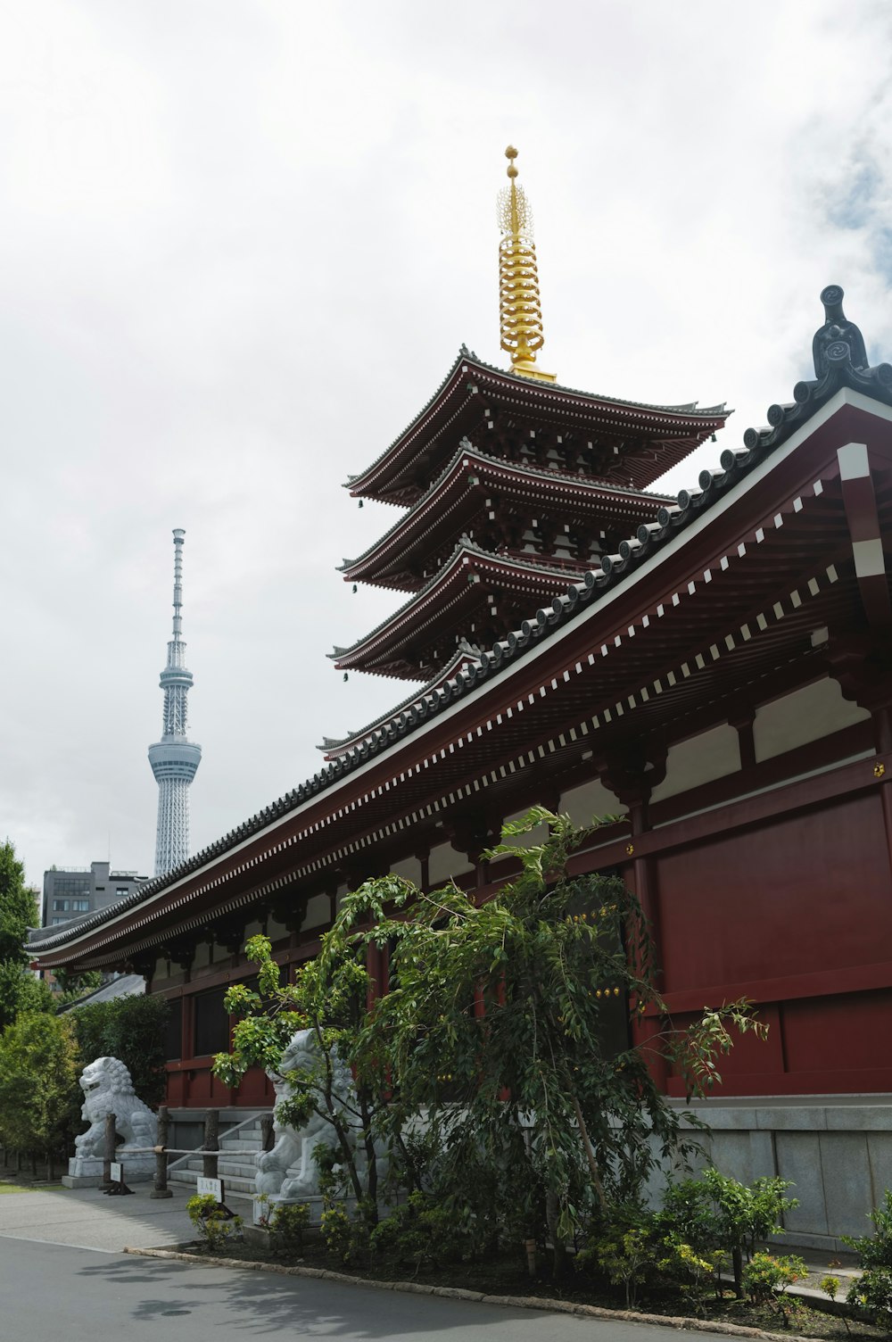 a tall building with a tall tower in the background