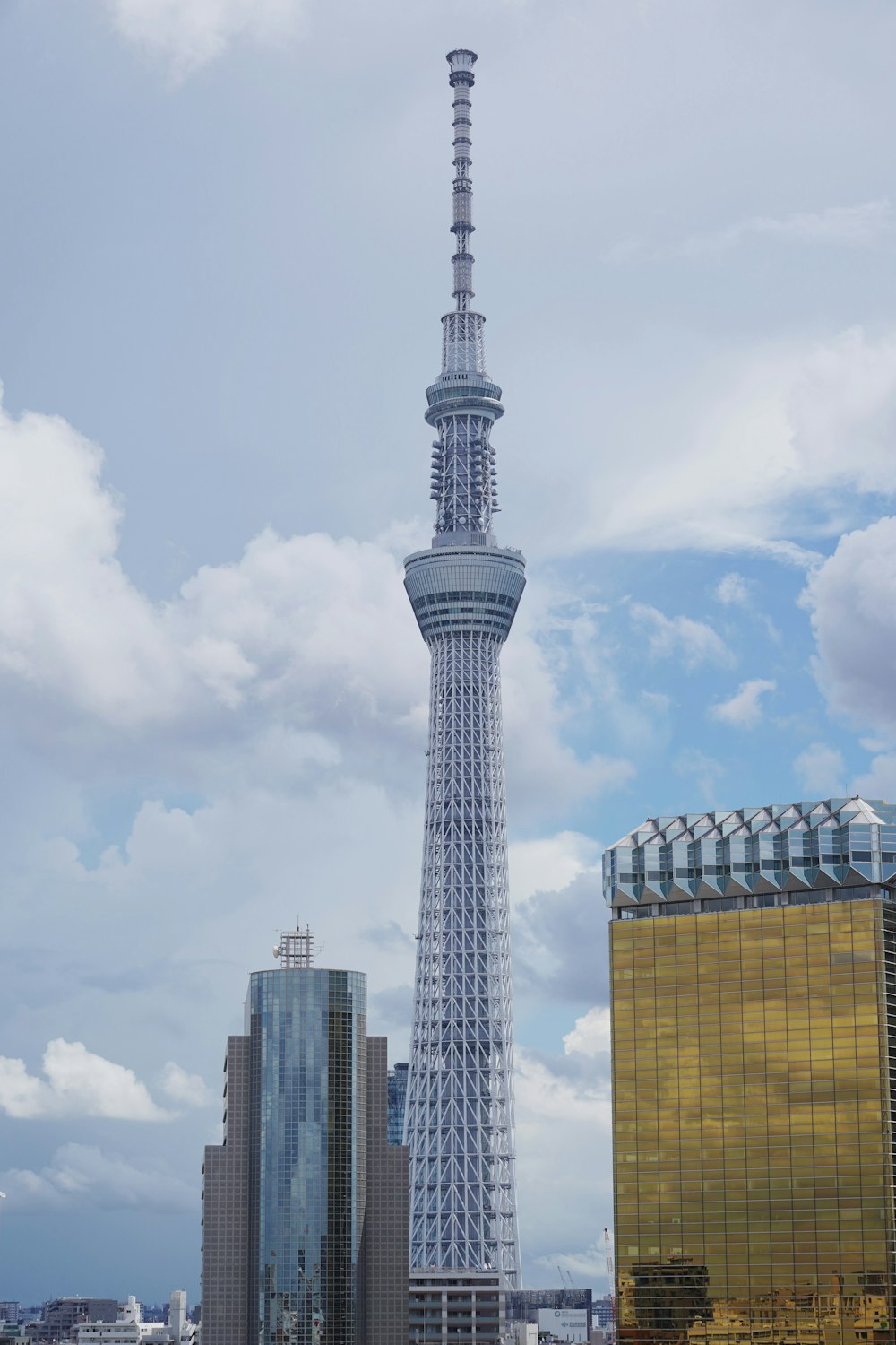 a very tall tower towering over a city