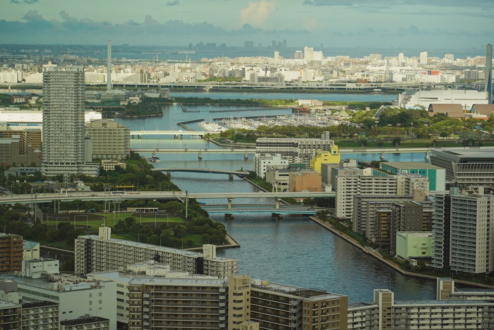 a river running through a city next to tall buildings