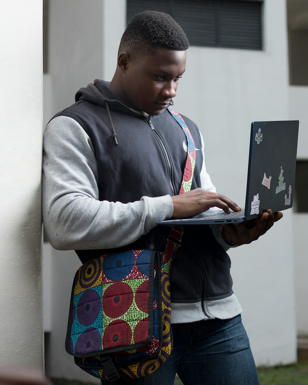 a man with a laptop in his hand