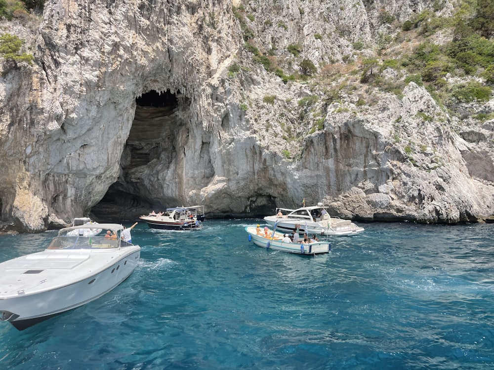 a group of boats floating in a body of water