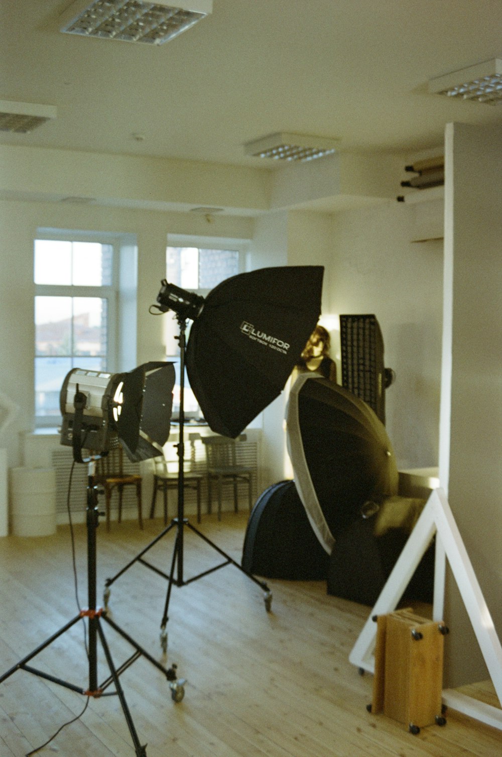 a camera and a tripod in a room