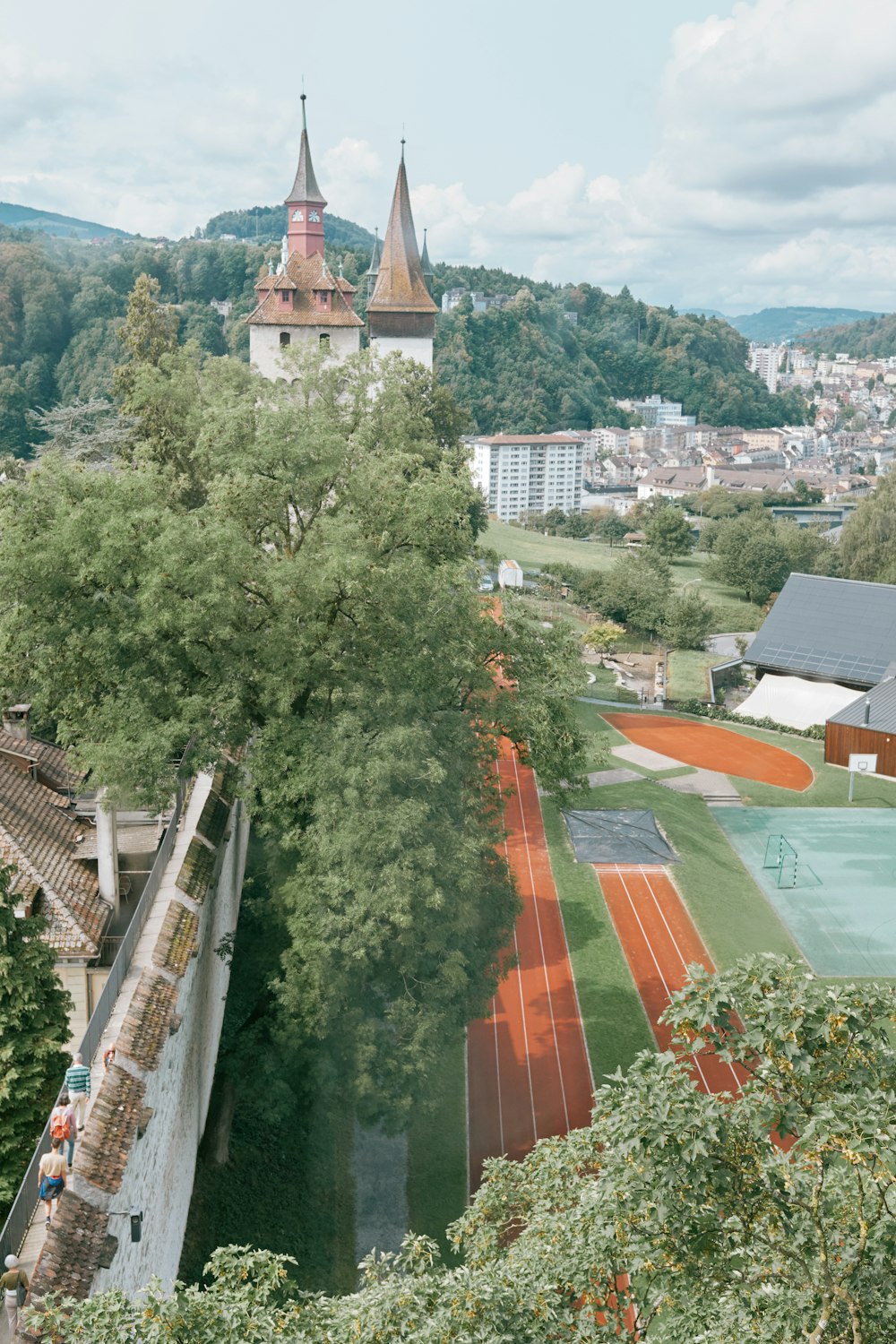 a view of a tennis court from a high point of view