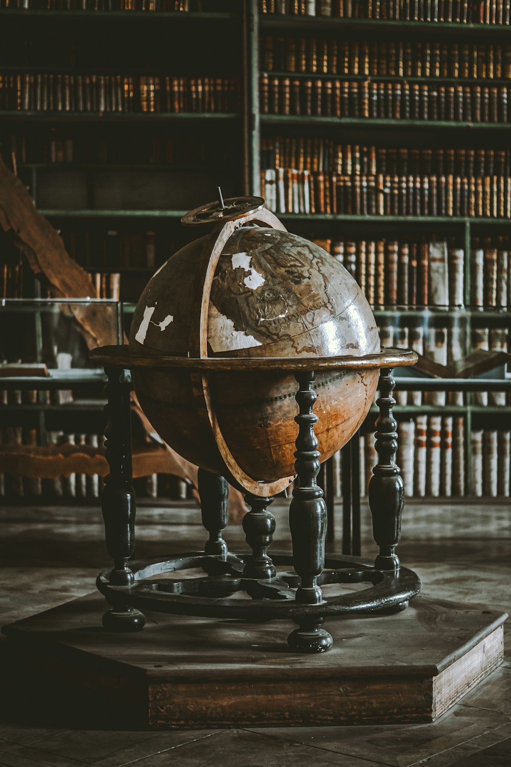 a globe sitting on top of a wooden table