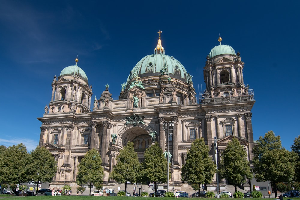 a large building with a green dome on top of it