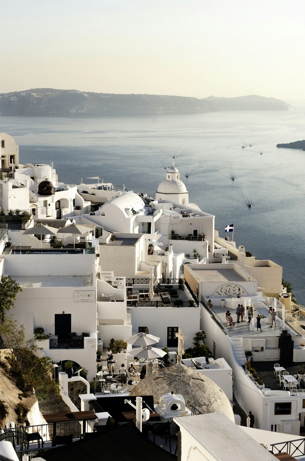 a view of a city with white buildings and a body of water