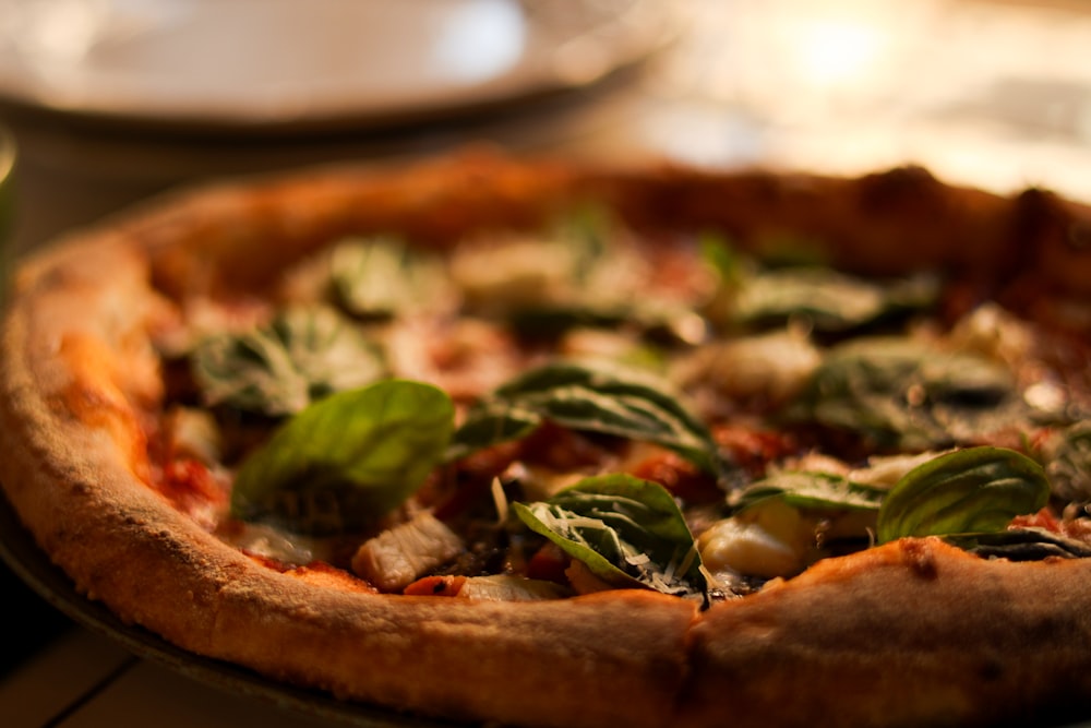 a pizza sitting on top of a pan on a table