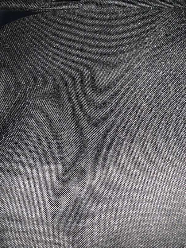 Close-up of smooth graphite nylon sheet texture highlighting its matte finish.