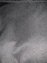 Close-up of sleek style's black and grey premium unstitched fabric texture.