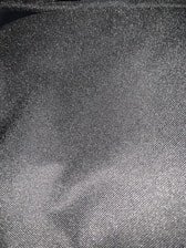 Close-up of premium breathable fabric in charcoal grey with subtle metallic silver threads.