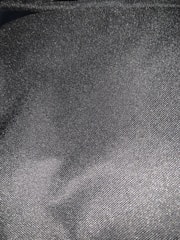 Close-up of a soft, heather gray t-shirt fabric highlighting its smooth texture and fine stitching.