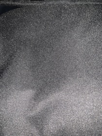 Close-up of sleek style's black and grey premium unstitched fabric texture.