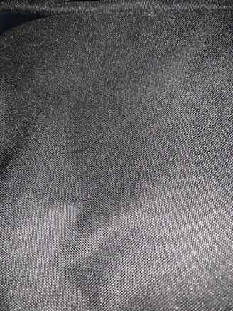 Close-up of smooth graphite nylon sheet texture highlighting its matte finish.