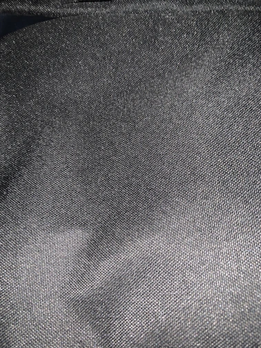 Close-up of smooth graphite nylon sheet texture highlighting its matte finish.