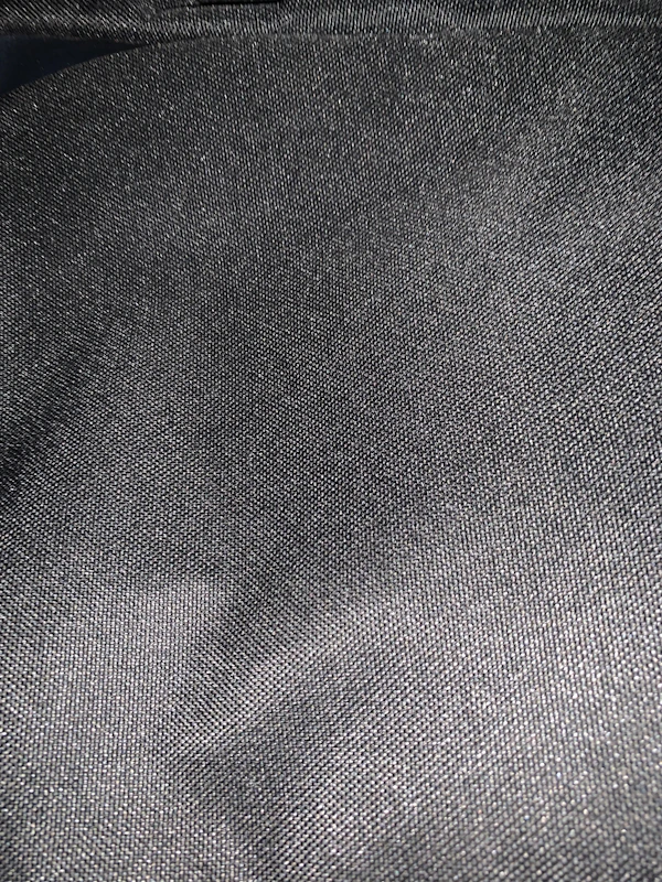 Close-up of smooth graphite nylon sheet texture highlighting its matte finish.
