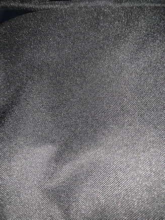 Close-up of smooth graphite nylon sheet texture highlighting its matte finish.