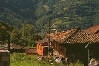 an old building in the middle of a field