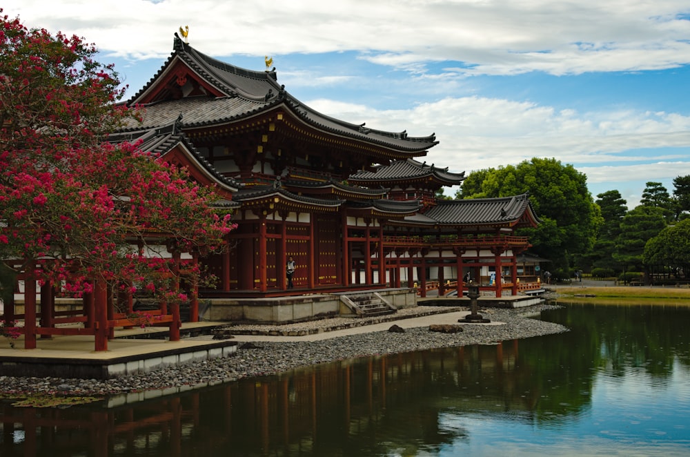 a large building sitting next to a body of water