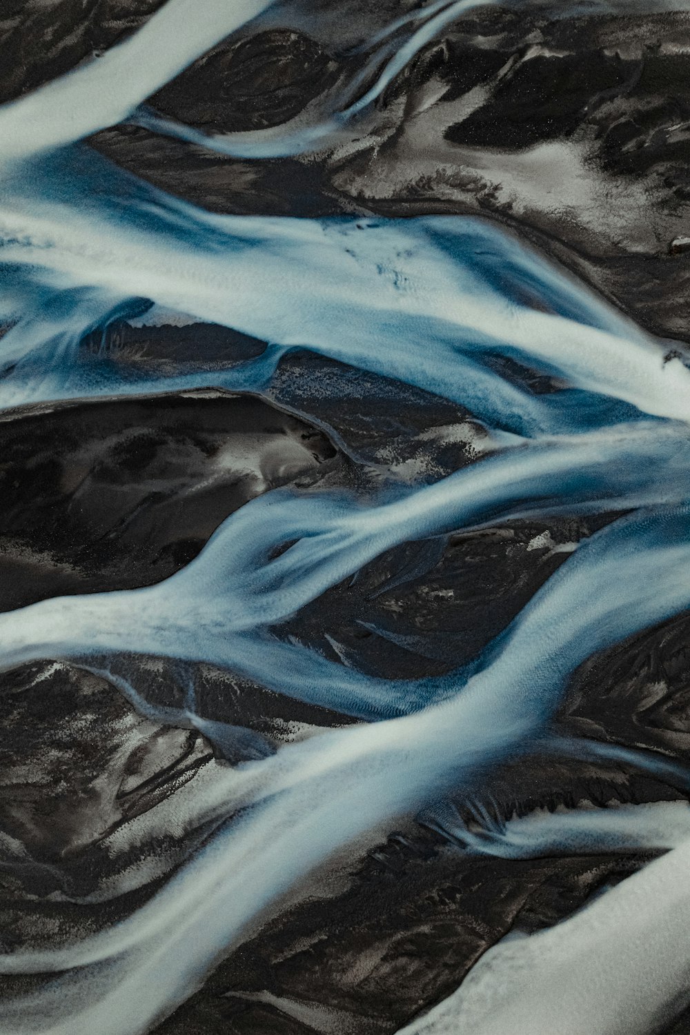 an aerial view of a river flowing through a valley