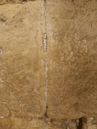 Cross-section view showing fire seal materials filling a wall penetration.