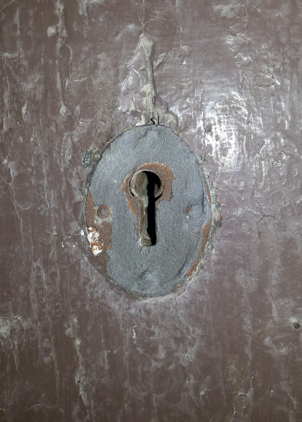 a door with a keyhole in the middle of it
