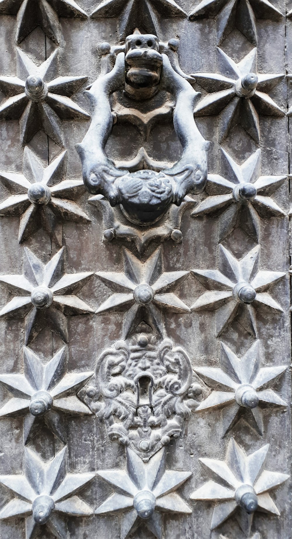 a close up of a door with a decorative design on it