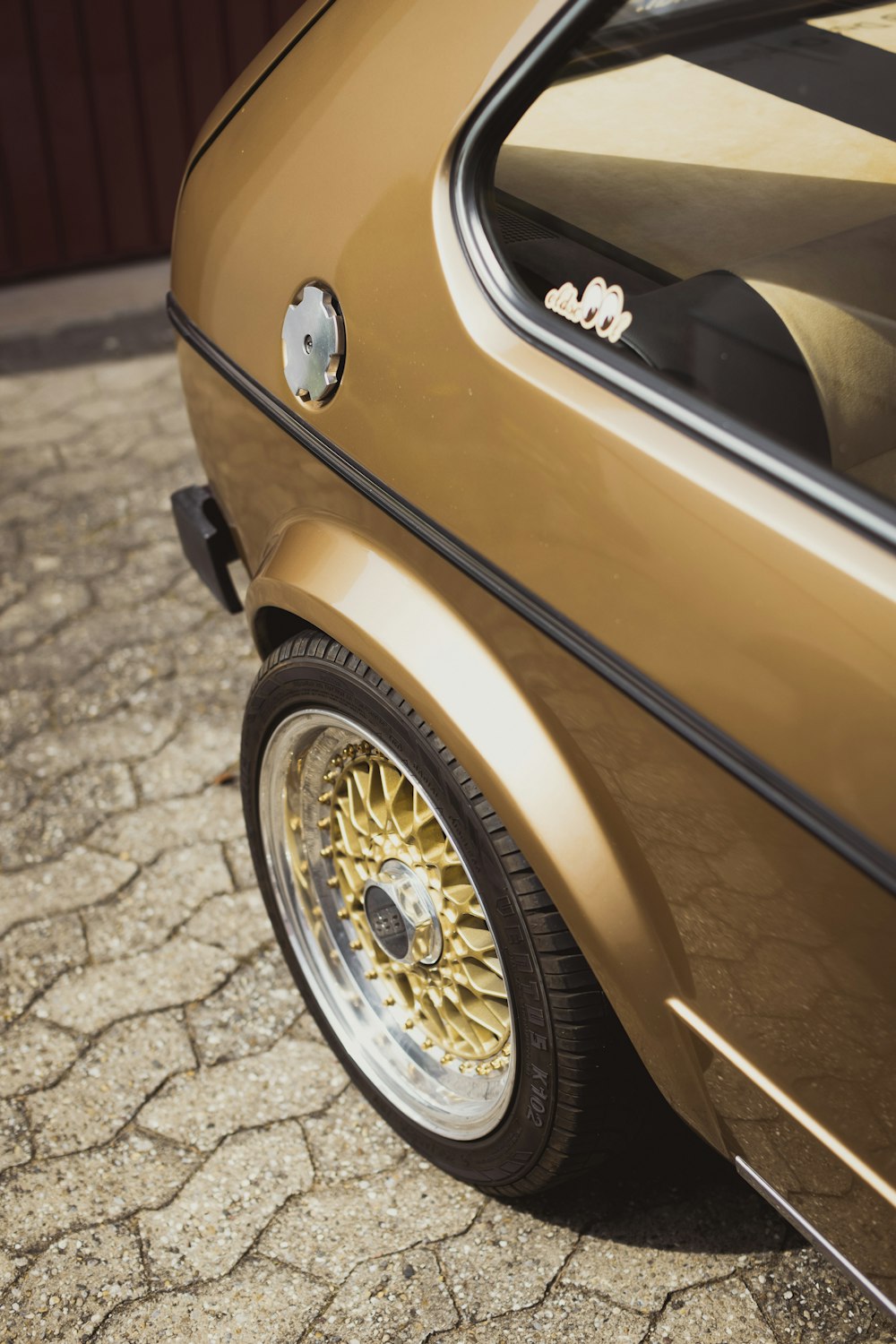 a close up of a car parked on a street