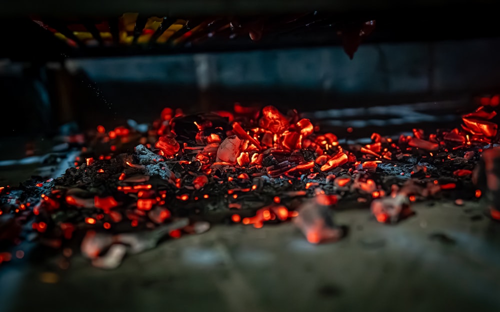 a pile of red hot coals sitting on top of a table