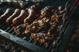 a bunch of food is cooking on a grill